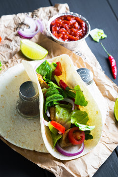 Taco, tortilla with meat and vegetables