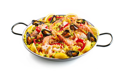 Pan of yellow rice and seafood over white