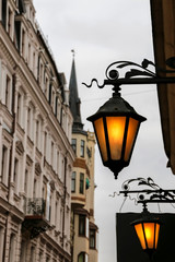 Fototapeta na wymiar Beautiful street lanterns illuminated at evening. Riga. Latvia.