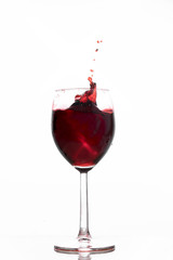 Red wine waving into a glass