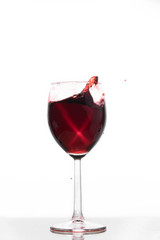 Red wine waving into a glass