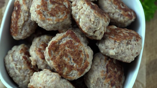 Portion of rotating Mini Burgers (seamless loopable 4K UHD footage)