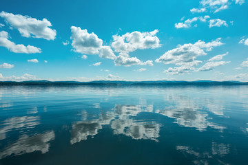 Russia. The Southern Urals. Lake Turgoyak.
Clouds reflected on the water surface of the lake in...