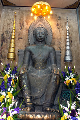 Phra Khandhararat green sandstone Dvaravati Buddha at Wat Na Phra Meru.