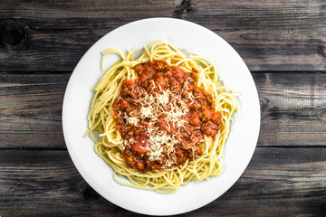 Cooked spaghetti bolognese on white plate..