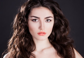 Fototapeta premium serious face with brown eyes, black background