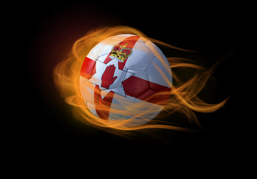Soccer ball with the national flag of Northen Ireland, making a flame.