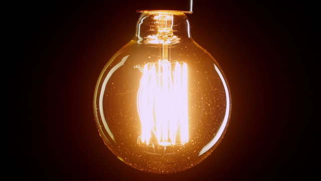 light bulb flickering. Vintage filament Edison light bulb. 
