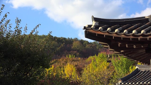 Traditional Hanok roof with a wind chimes in the Minsok Folk Village. Seoul