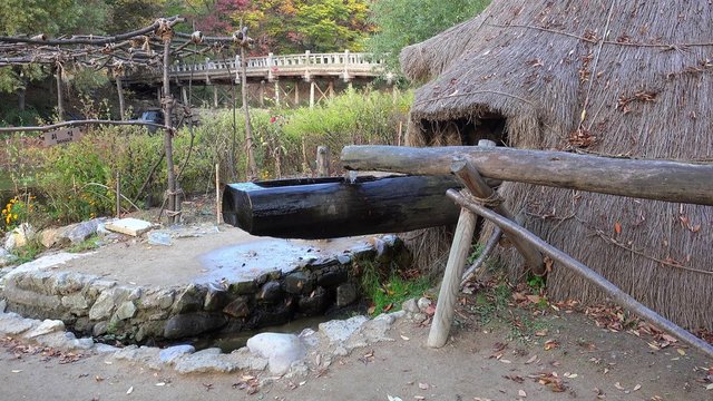 Water powered tilt hammer mill in the Minsok Korean Folk Village. Seoul