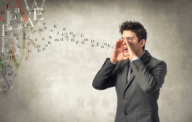 Young businessman screaming
