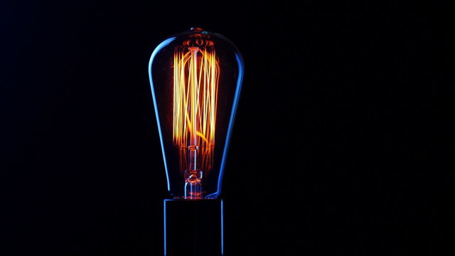 Vintage filament Edison light bulb. Close up. 
