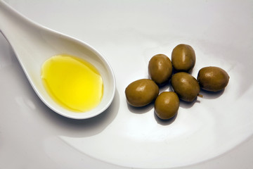 Green olives in a white bucket, a typical product of Andalusia,