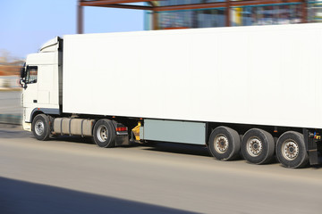 truck driving on city street