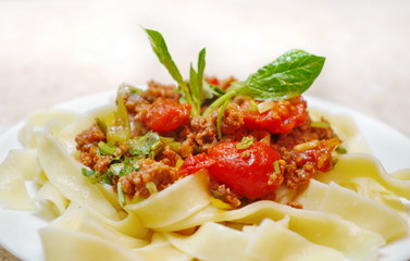 freshly cooked spaghetti bolognese dish served on wooden table
