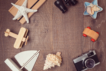 Travel and vacation concept background on wood. View from above. Flat lay