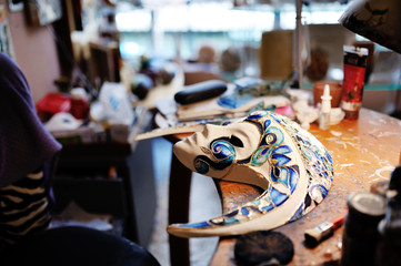 Beautiful Venetian mask, white and blue colors on the shop table