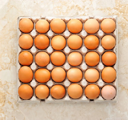 Farm egg in paper container. Top view