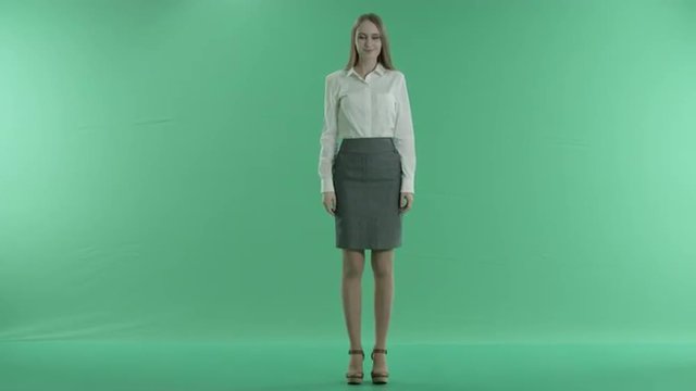 business woman is happy gesture on a green screen