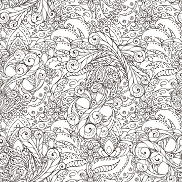 Seamless pattern of abstract flowers and paisley elements in Indian mehendi style.