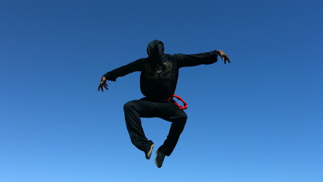Ninja jumps in air, slow motion