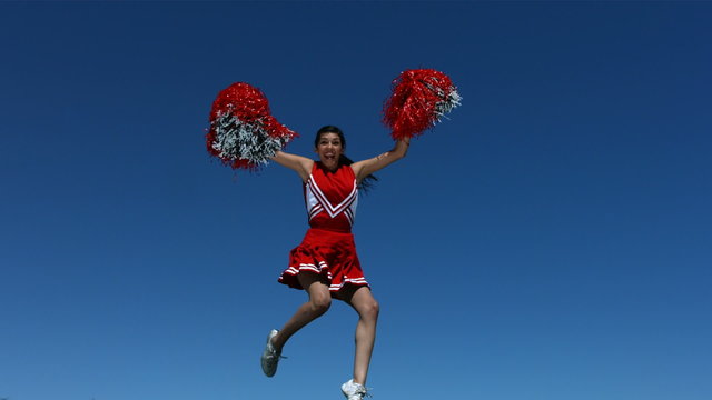 Cheerleader flies into the air, slow motion