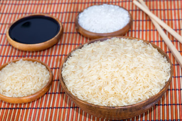 Rice in wooden plate with soy sauce