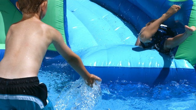 Two boys playing in pool