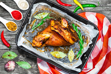 roast pork knuckle in a baking dish, view from above