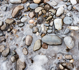 Stones in the ice on the nature