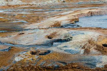 Mud pots in geothermal area in the north of Iceland.