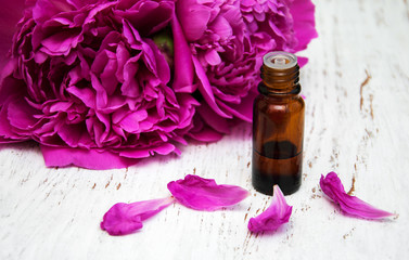 Peony flowers and  massage oils