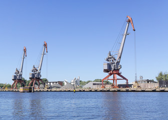 Fototapeta premium Cargo cranes in port