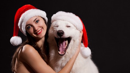 Luda. Face Christmas hat with dog, black background, blue eyes!