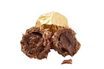 Isolated chocolate candies with nuts and praline