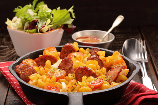Casserole with chorizo sausage in a frying pan
