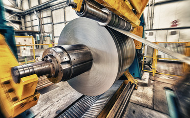 Metal coils machine. Interior of factory. Business concept - obrazy, fototapety, plakaty