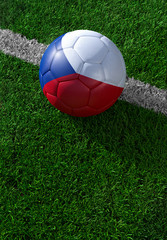 Fototapeta na wymiar Soccer ball and national flag of Czech Republic, green grass