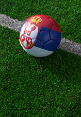 Plakat Soccer ball and national flag of Serbia, green grass