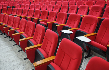 Fototapeta premium rows of red chairs in auditorium