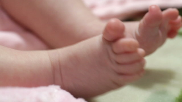 new born baby girl feet close up