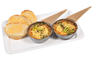 French cuisine julienne in metal cup, isolated studio shot.