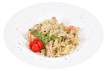 Italian cuisine fettuccine, pasta with shrimps, in white serving
