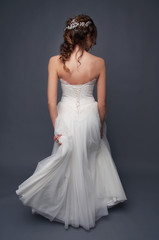 Fototapeta premium Bridal fashion. Brunette bride view from the back.