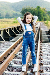 Girl walk on the railway