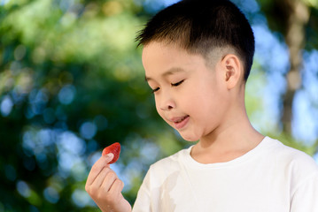 Boy and Strawberry