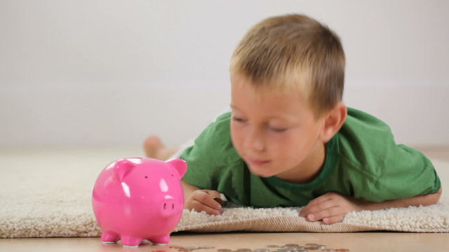 Boy with piggy bank
