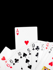 Playing cards isolated on black background.
