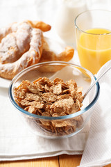 Cornflakes with croissant  for breakfast
