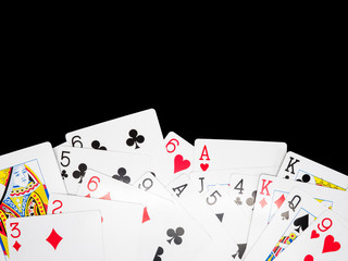 Playing cards isolated on black background.